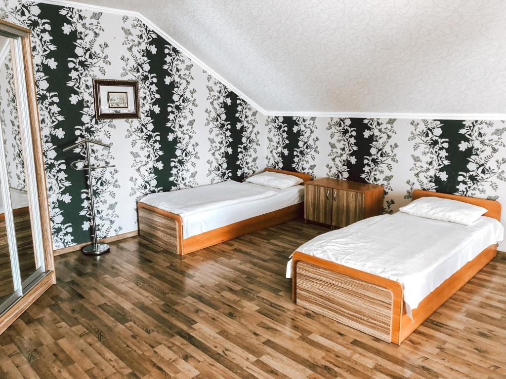 Postel nebo postele na pokoji v ubytování Koral Hotel