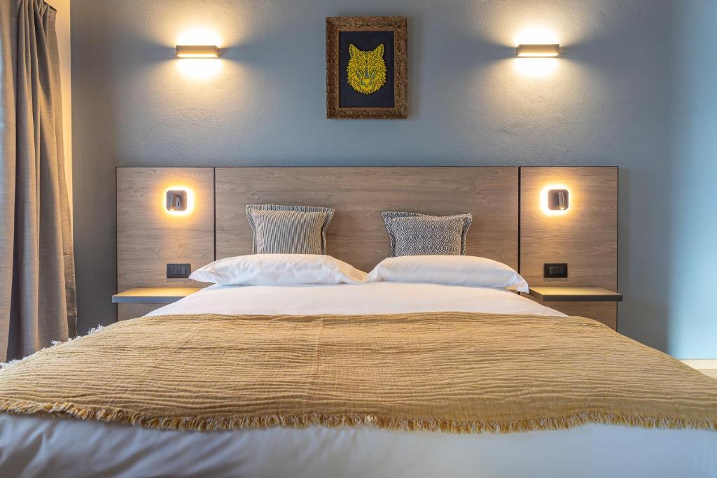 Postel nebo postele na pokoji v ubytování Hotel Mon Émile