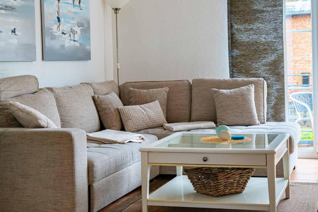 a living room with a couch and a coffee table at Haus Katharina in Lauterbach