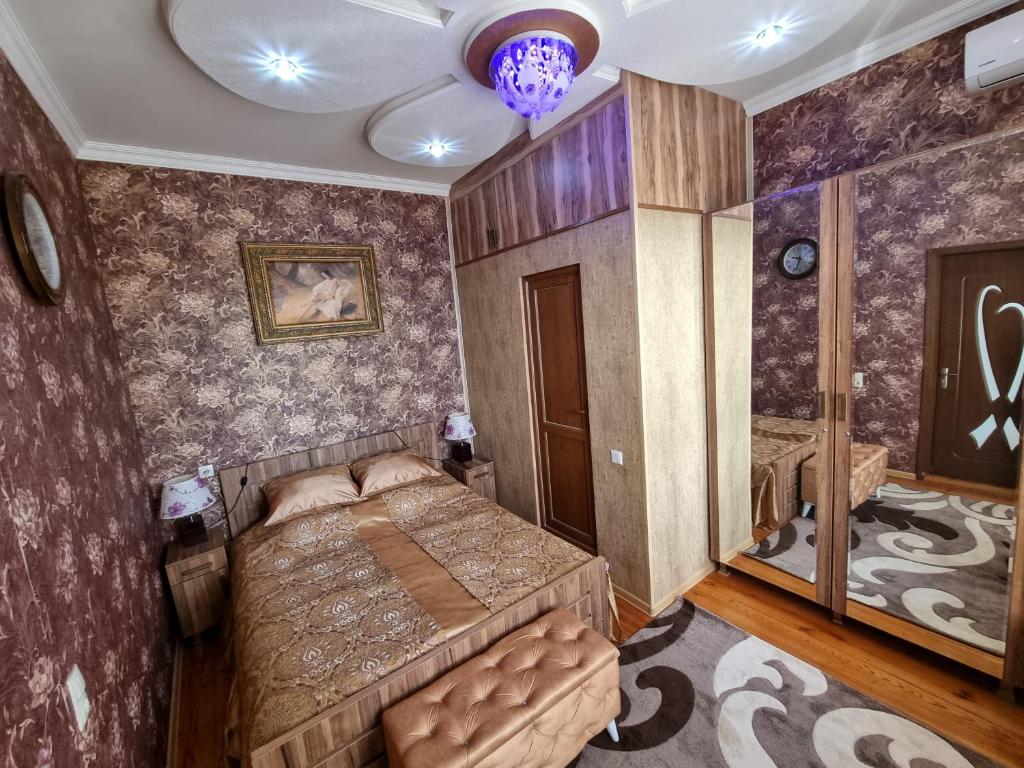 a bedroom with a bed and a ceiling at Hostel Sadu Kutaisi in Kutaisi