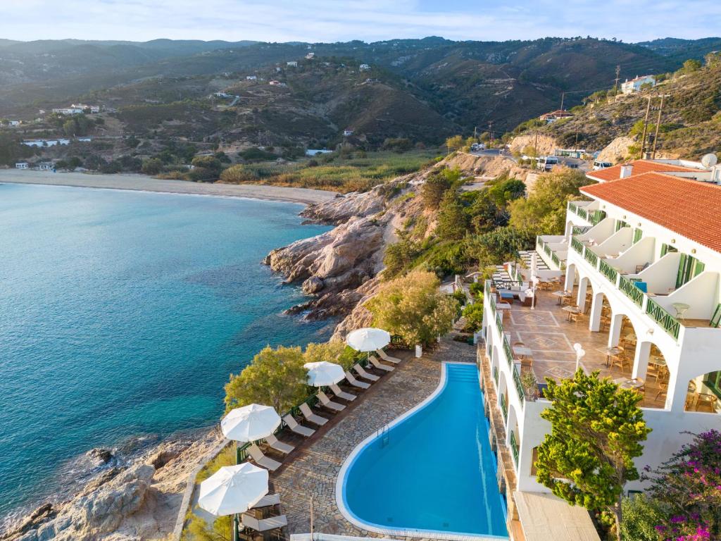 an aerial view of a resort with a swimming pool and the ocean at Erofili Beach Hotel in Armenistis