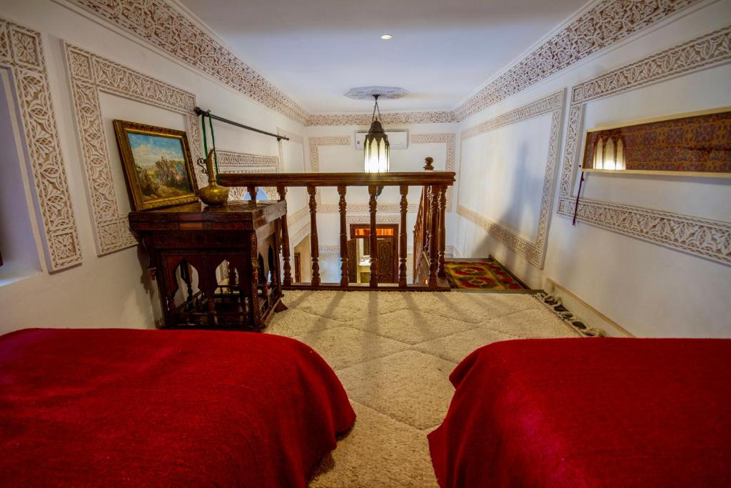 Postel nebo postele na pokoji v ubytování Riad Dombaraka