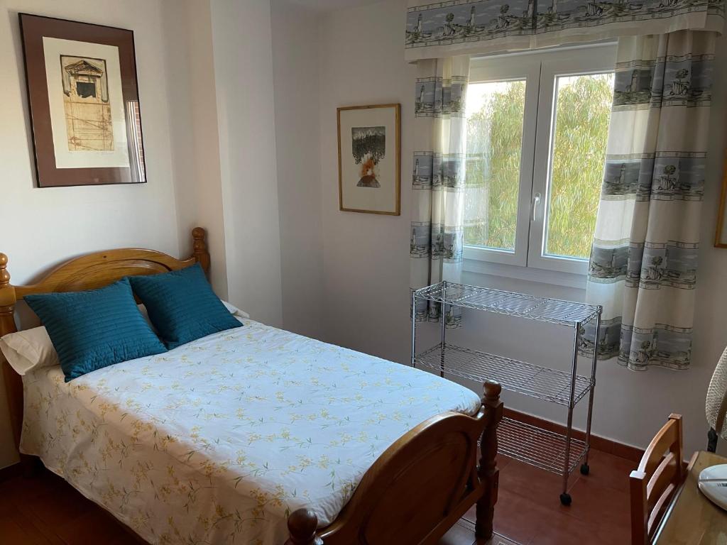 Posteľ alebo postele v izbe v ubytovaní Apartamento Ravel Playa Málaga