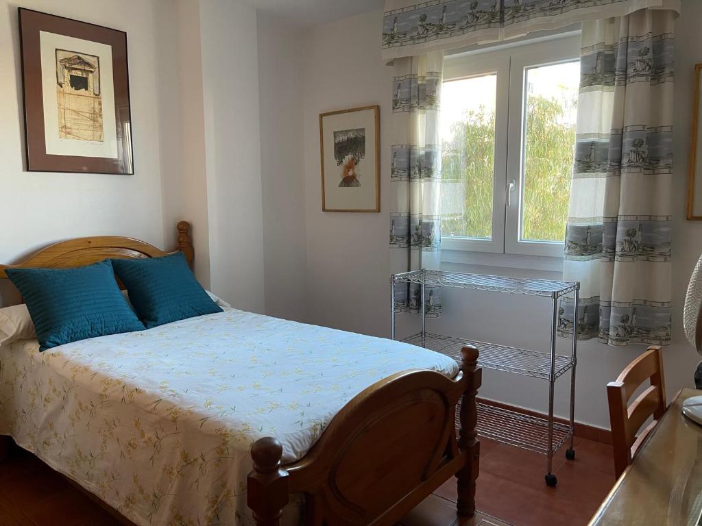 Posteľ alebo postele v izbe v ubytovaní Apartamento Ravel Playa Málaga