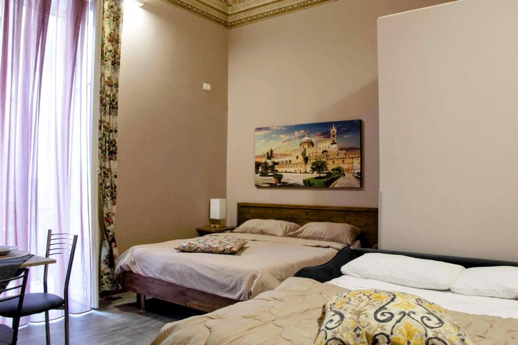 Łóżko lub łóżka w pokoju w obiekcie B&B Benincasa