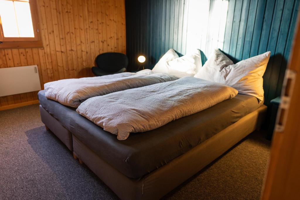 Postel nebo postele na pokoji v ubytování Ferienwohnung im Chalet am Bach