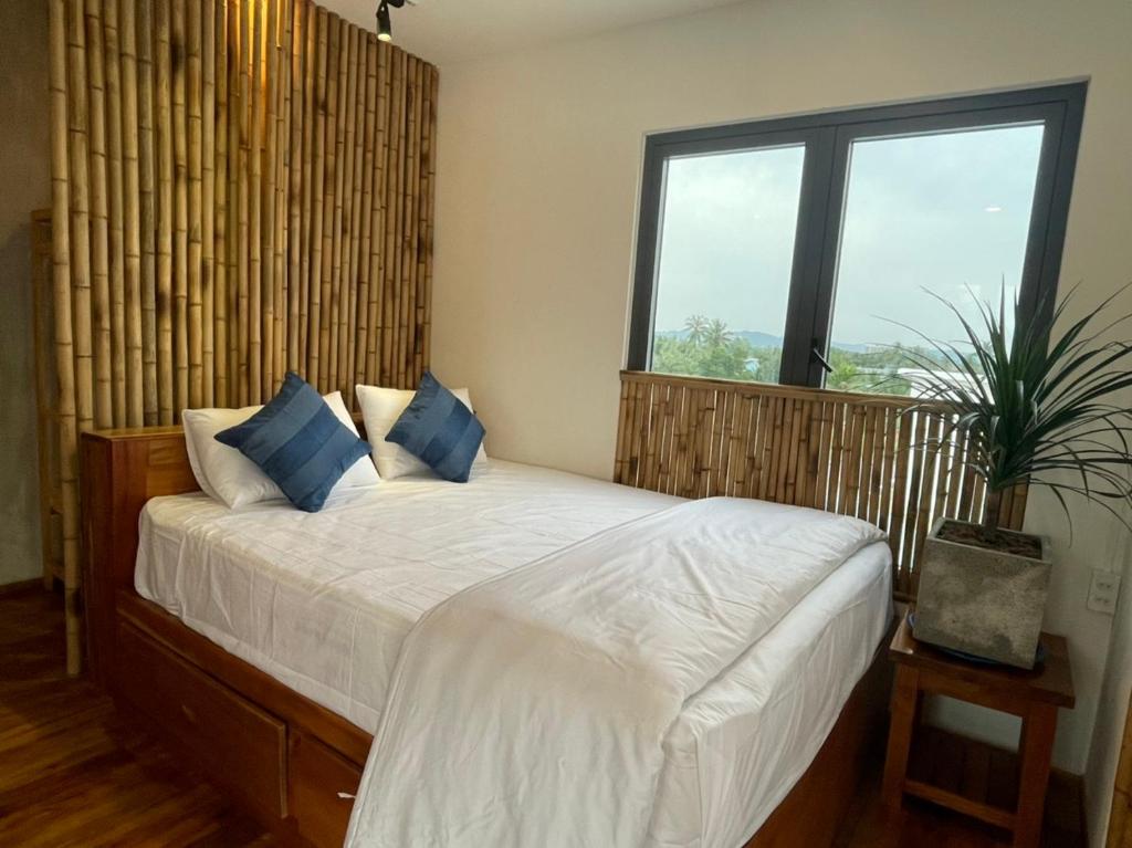 Giường trong phòng chung tại Eco Lagoon