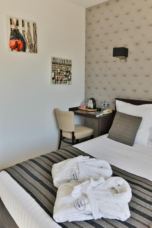 Postel nebo postele na pokoji v ubytování Le Galet Hotel & Spa
