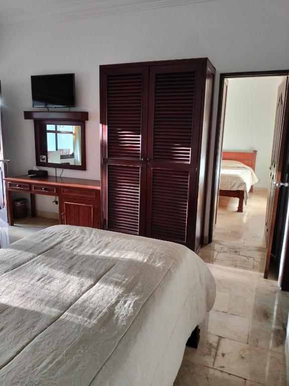 Postel nebo postele na pokoji v ubytování Grand Kumala Hotel - Hotel Kumala Legian Kuta Bali