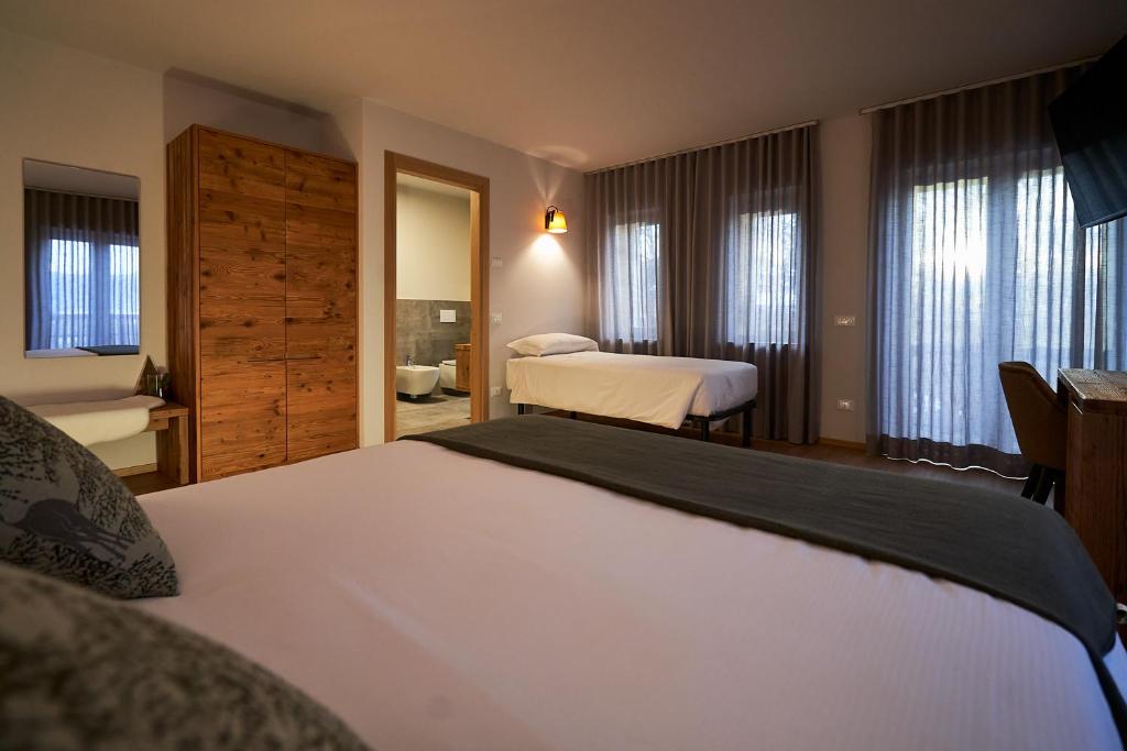 Postel nebo postele na pokoji v ubytování Hotel Ristorante Pennar