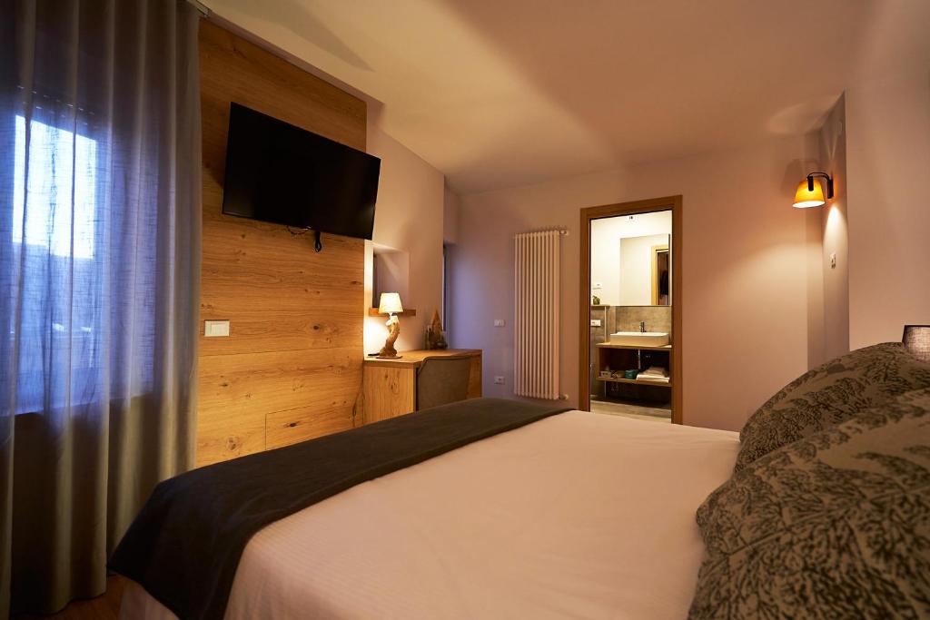 Postel nebo postele na pokoji v ubytování Hotel Ristorante Pennar