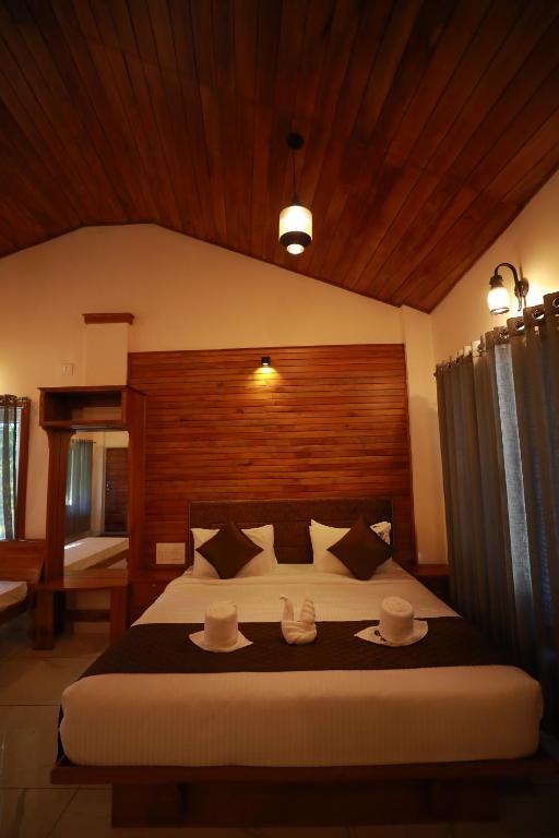 Postel nebo postele na pokoji v ubytování Coorg Coffee Bean Resort