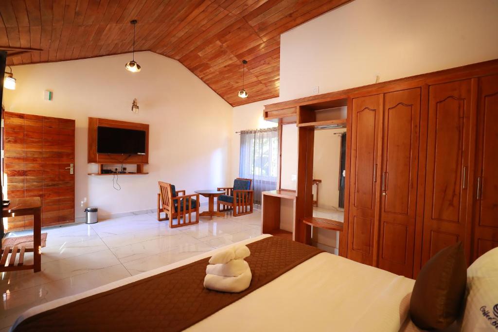 Postel nebo postele na pokoji v ubytování Coorg Coffee Bean Resort