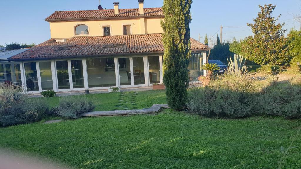 a house with a large yard with a house at La Fornace in Il Palazzone