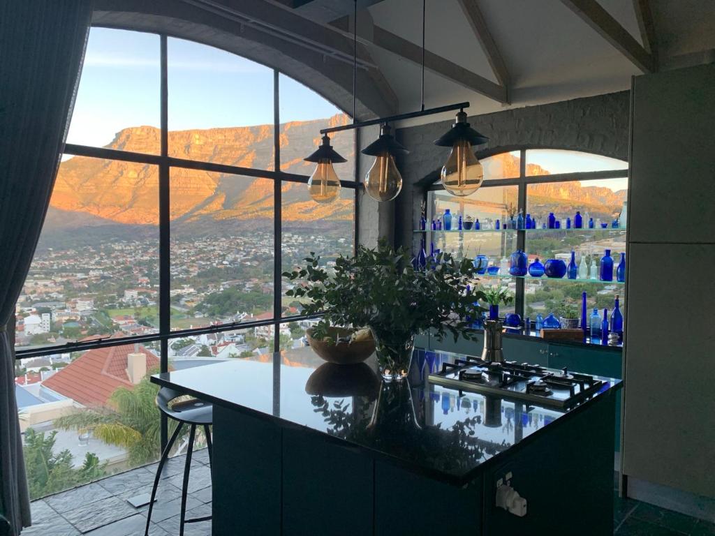 a kitchen with a view of a mountain at Eagles Nest in Cape Town
