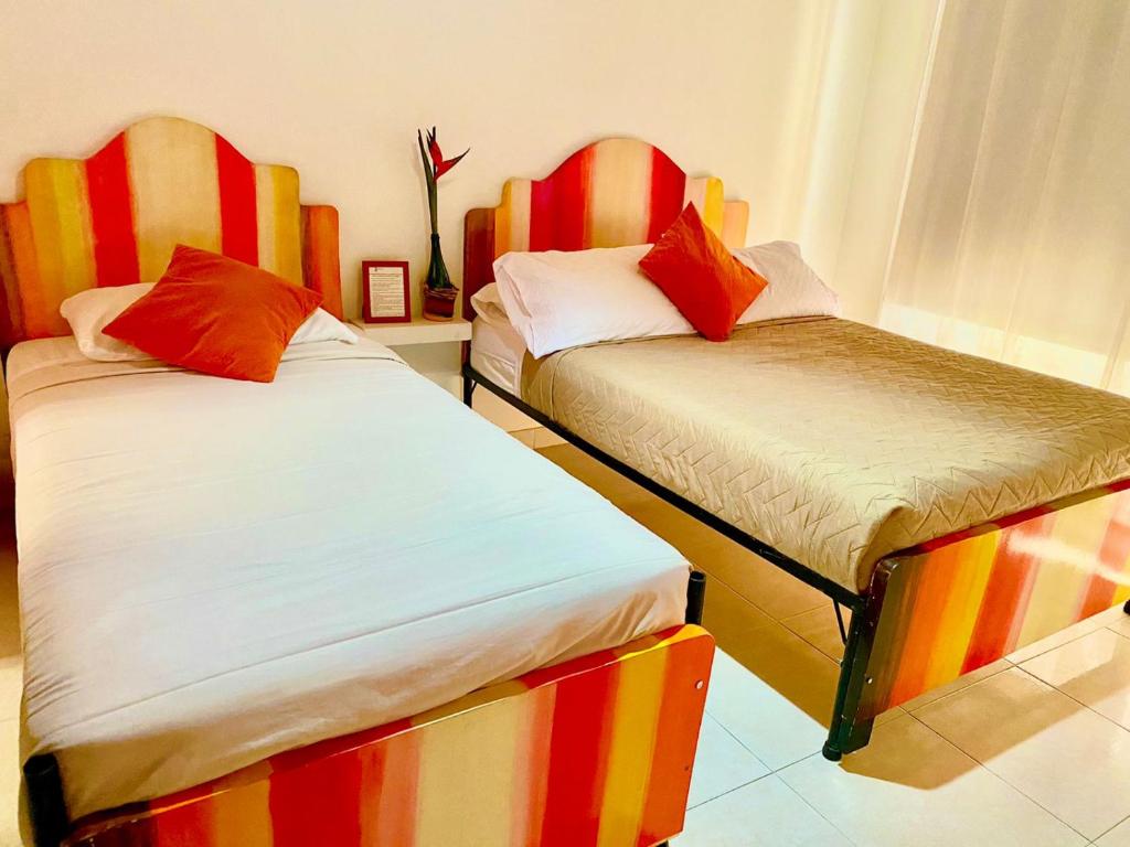 Postel nebo postele na pokoji v ubytování Hotel Casa La Pilonera