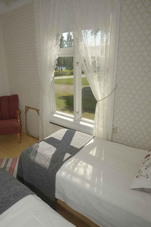Postel nebo postele na pokoji v ubytování Bruksgården