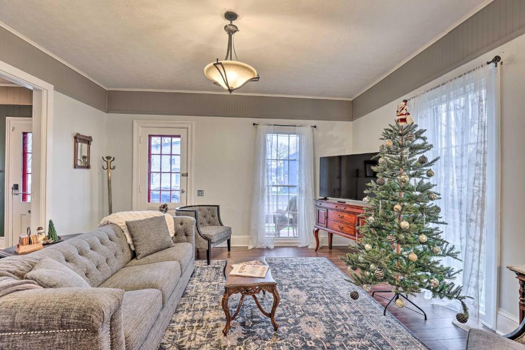a living room with a christmas tree in it at Victorian Home in Penn Yan about 1 Mi to Keuka Lake! in Penn Yan