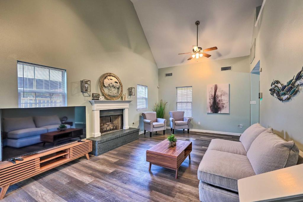 a living room with a couch and a fireplace at Tranquil Retreat with Dock on Lake Hamilton! in Hot Springs