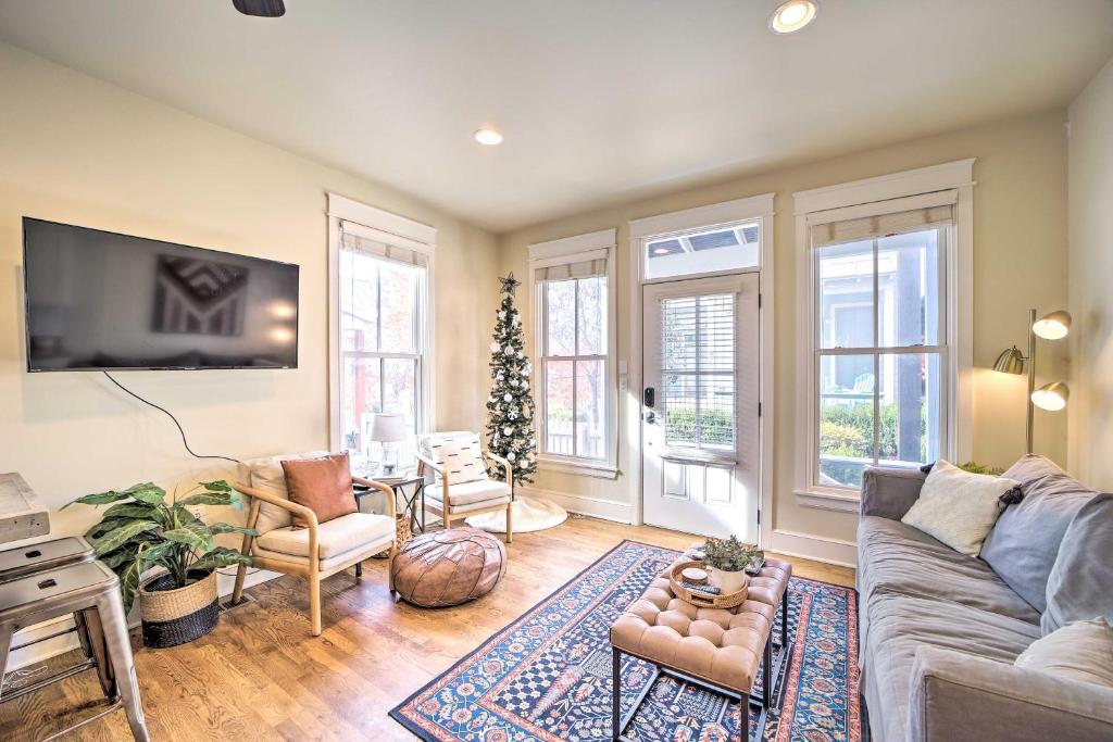 a living room with a couch and a christmas tree at Carlton Landing Home Walk to Lake and Parks! in Canadian