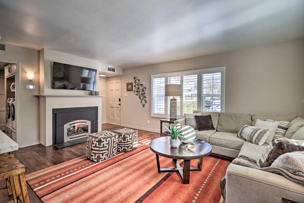 a living room with a couch and a fireplace at Modern Reno Abode Near Parks and Midtown! in Reno