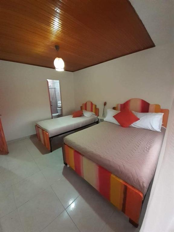 Postel nebo postele na pokoji v ubytování Hotel Casa La Pilonera