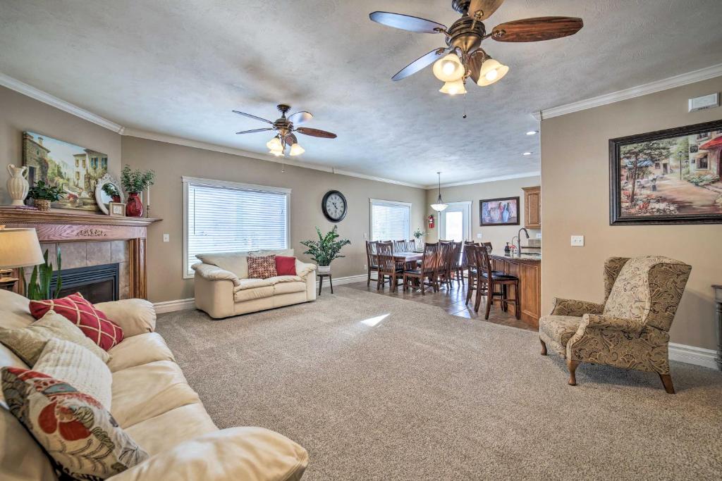 a living room with a couch and a dining room at Spacious Idaho Home Ski, Hike, and Fish! in Rexburg