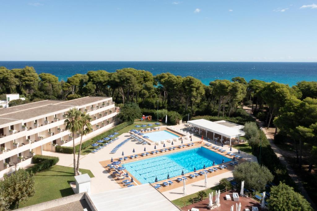 an aerial view of a hotel with a swimming pool at VOI Daniela Essentia in Conca Specchiulla