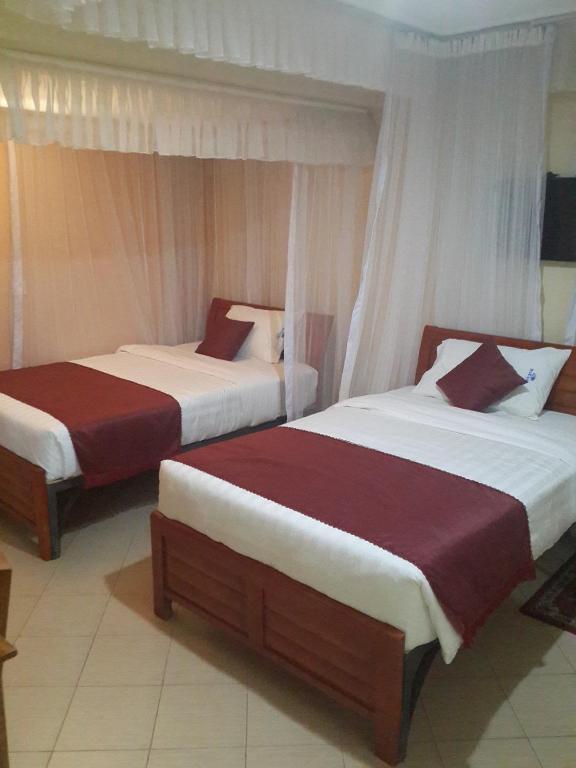 Postel nebo postele na pokoji v ubytování Decasa Hotel