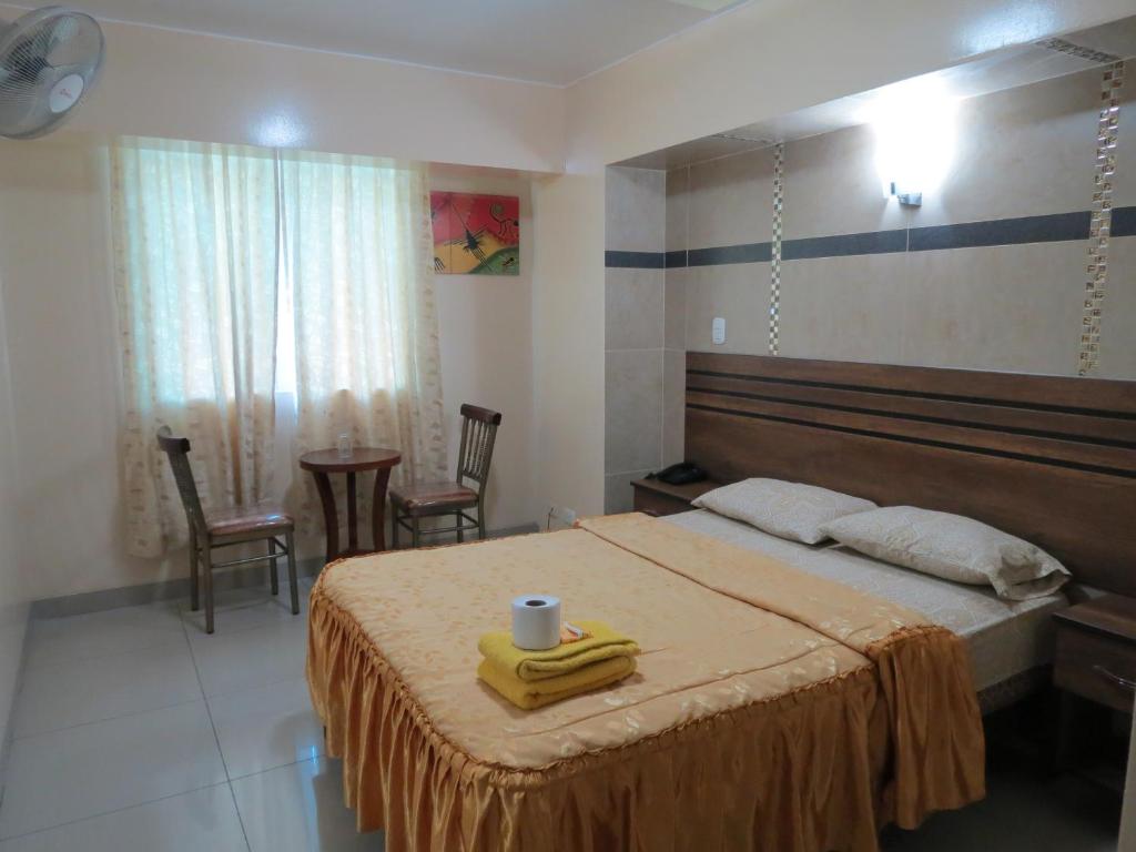 Postel nebo postele na pokoji v ubytování HOTEL ESTRELLA