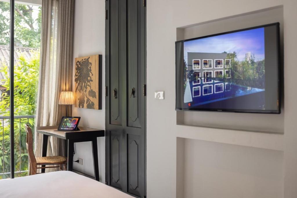TV a/nebo společenská místnost v ubytování Hotel Ping Silhouette