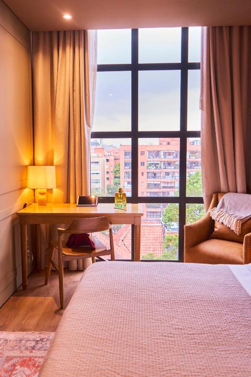 Postel nebo postele na pokoji v ubytování Hotel Coco