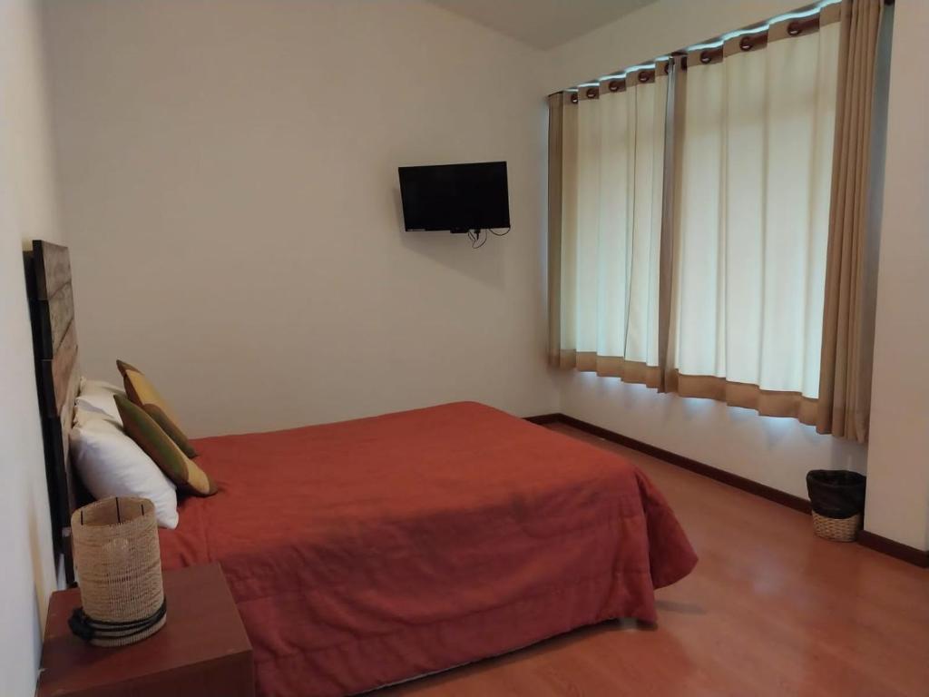 Postel nebo postele na pokoji v ubytování Fundo Hotel Ayarpongo