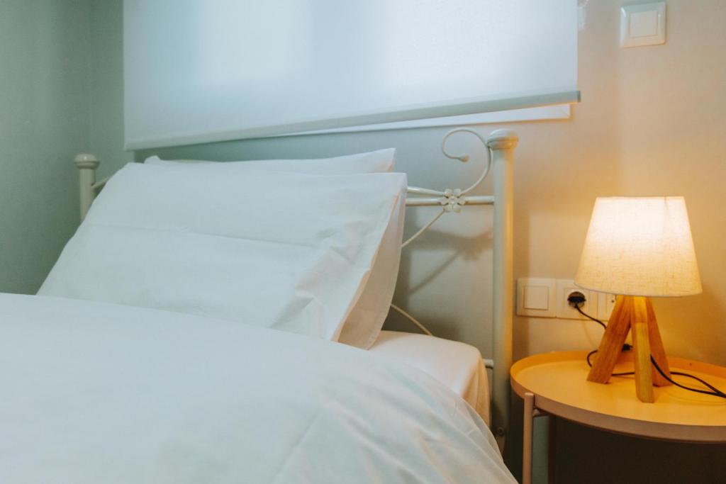 Postel nebo postele na pokoji v ubytování Hermes Appartment
