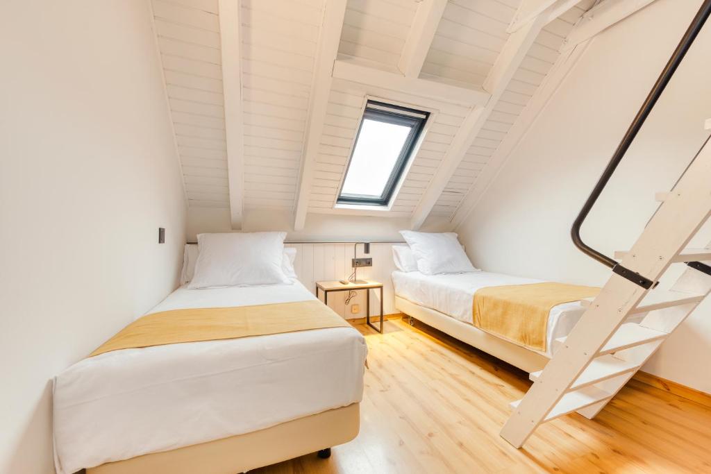 Postel nebo postele na pokoji v ubytování Hotel Viella