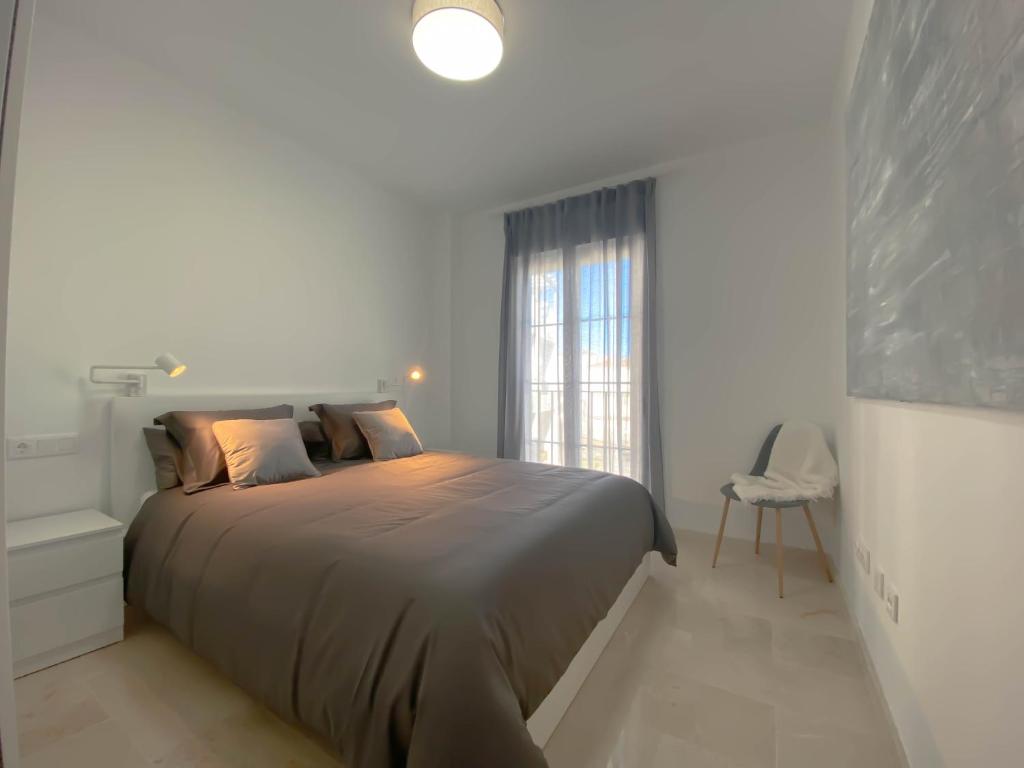 A bed or beds in a room at Happy Memories apartamento de vacaciones