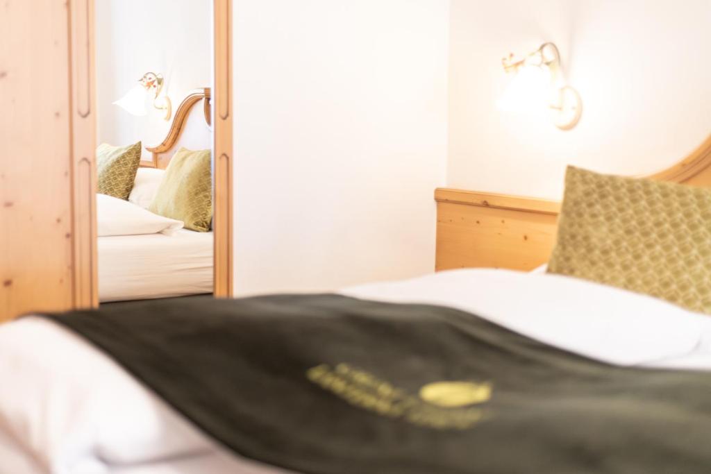 Łóżko lub łóżka w pokoju w obiekcie B&B Grüne Laterne - Lanterna Verde