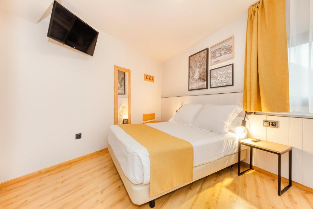 Postel nebo postele na pokoji v ubytování Hotel Viella