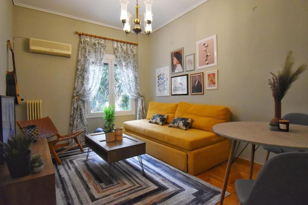 a living room with a couch and a table at Vintage Apartment in Athens