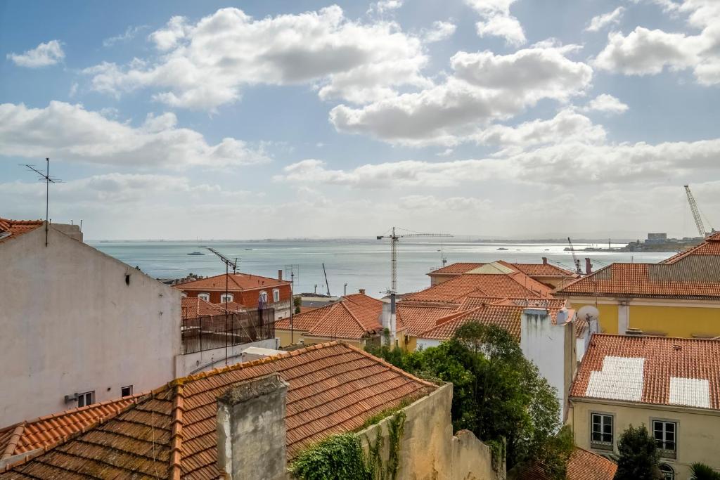 a view of the roofs of a town at ThisisLisbon - RiverView Apartment - 3rd in Lisbon