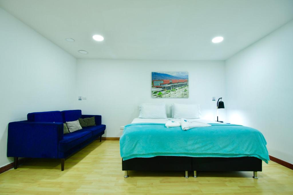 Postel nebo postele na pokoji v ubytování Poblado Park Guest House