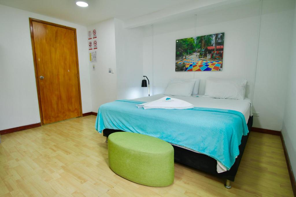 Postel nebo postele na pokoji v ubytování Poblado Park Guest House