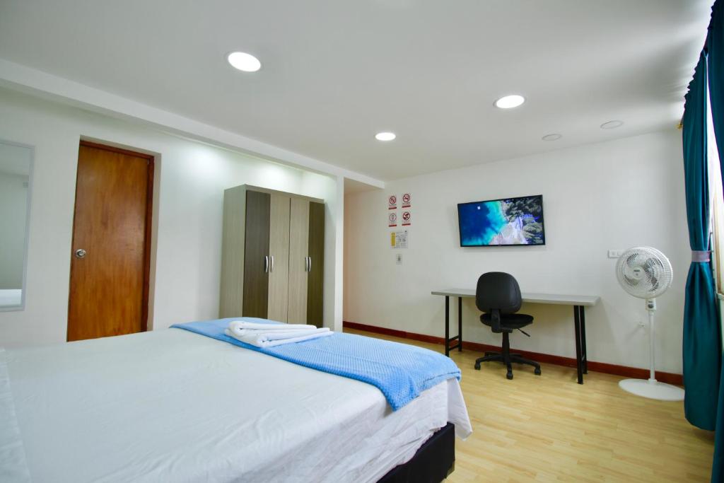 Postel nebo postele na pokoji v ubytování Poblado Park Guest House