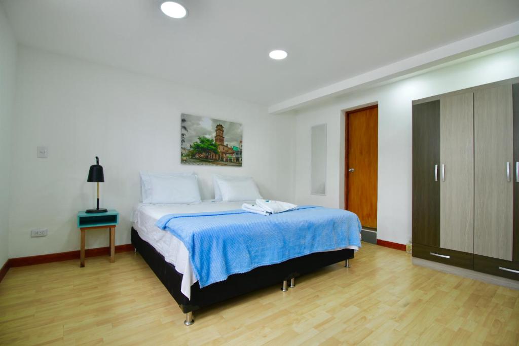 Postel nebo postele na pokoji v ubytování Poblado Park Guest House