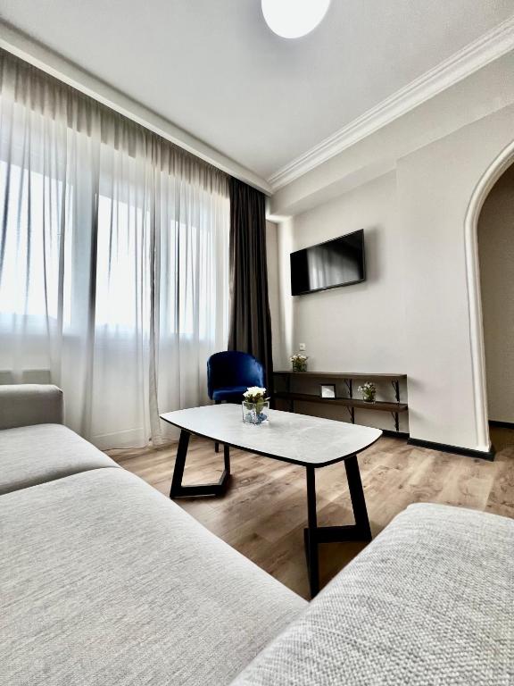 TV a/nebo společenská místnost v ubytování GABATA INN