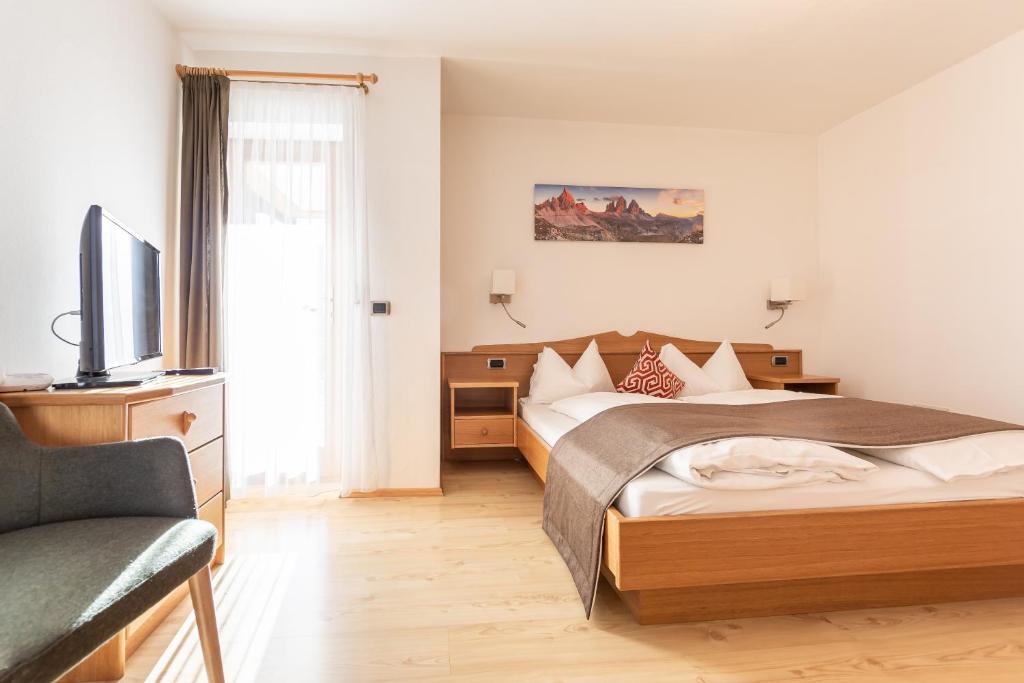 Łóżko lub łóżka w pokoju w obiekcie B&B Grüne Laterne - Lanterna Verde