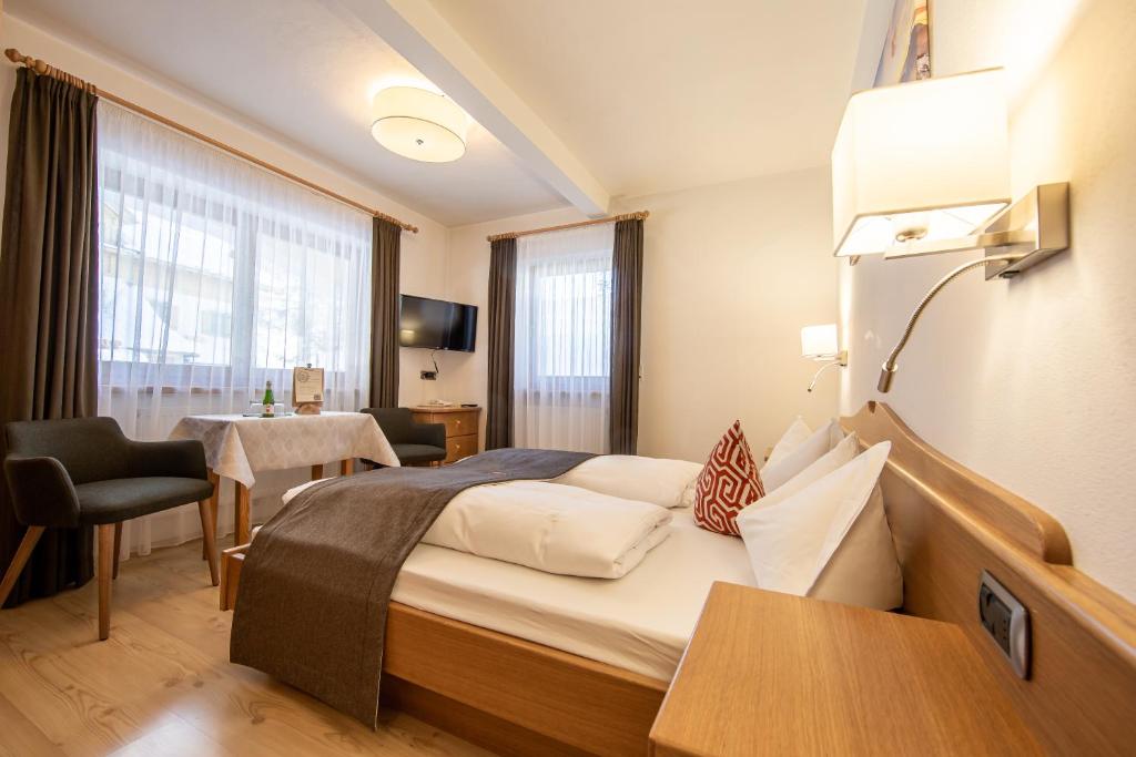 Łóżko lub łóżka w pokoju w obiekcie B&B Grüne Laterne - Lanterna Verde