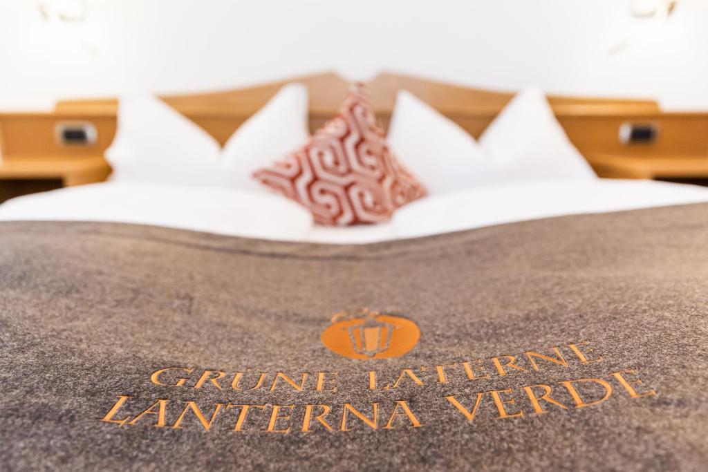 Łóżko lub łóżka w pokoju w obiekcie B&B Grüne Laterne - Lanterna Verde