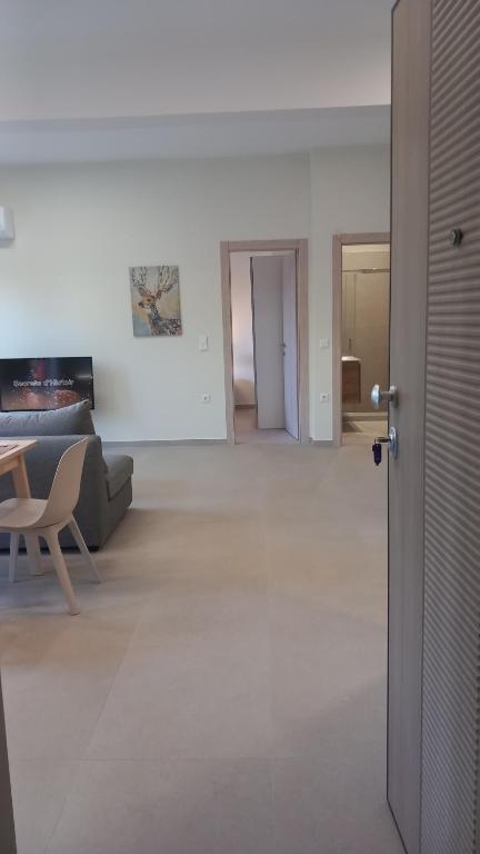 a living room with a couch and a table at King AGIS 2 in Sparta