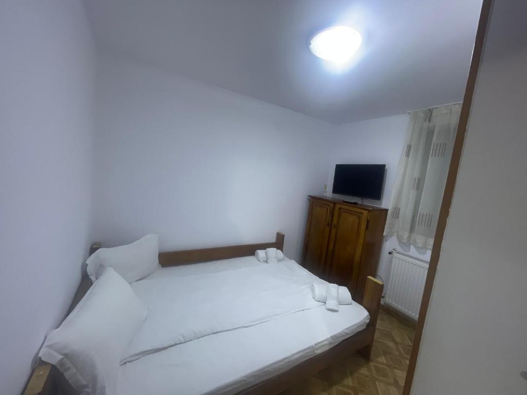 Postel nebo postele na pokoji v ubytování Vila Rustik Straja